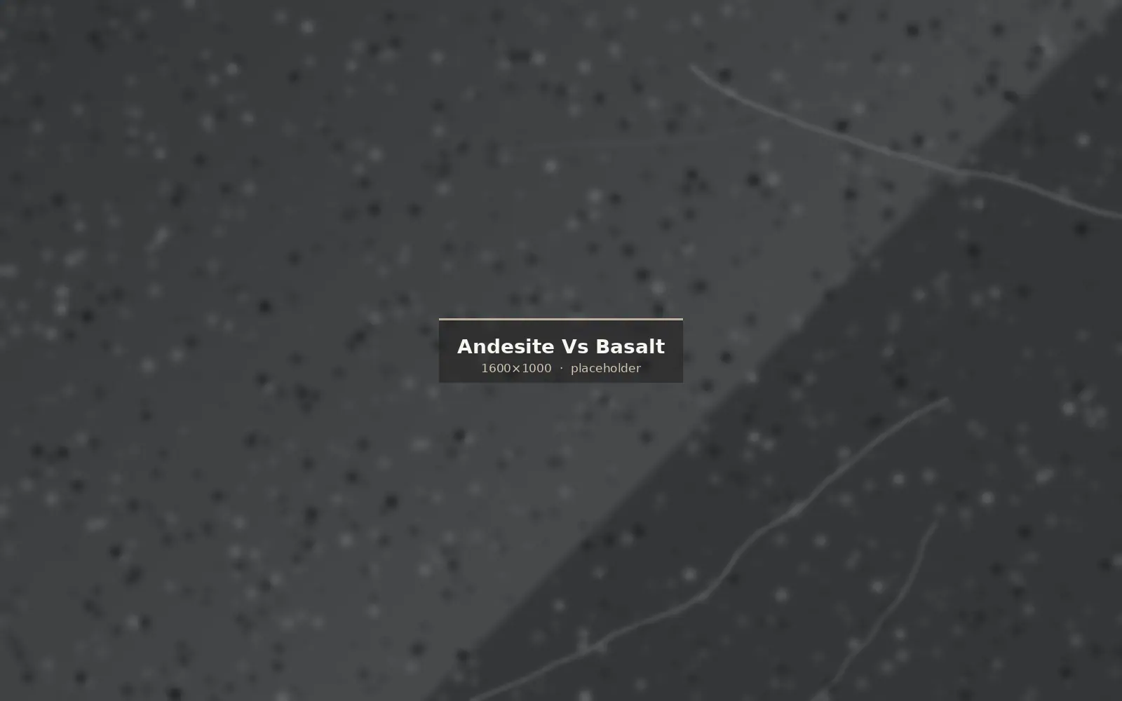 Side by side comparison of grey andesite and dark basalt paving samples